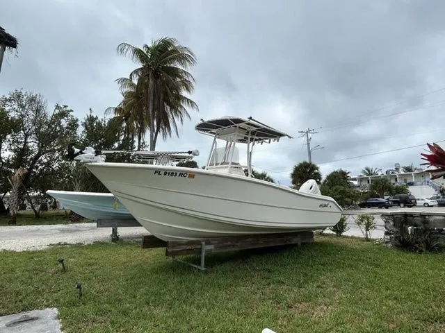 The Image of 2016 Bulls Bay 230 Center Console boat displayed on grass. - 1