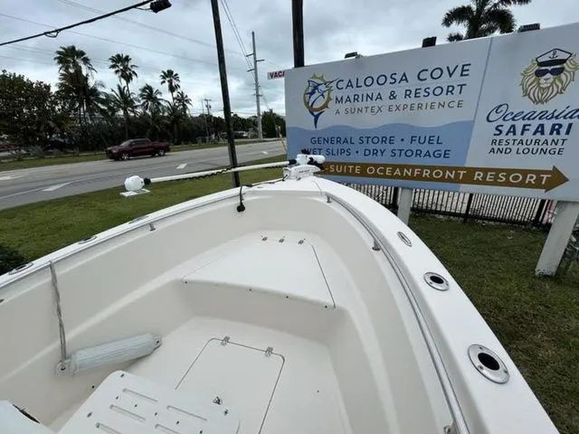 Slide: The Image of Bulls Bay 230 Center Console boat near Caloosa Cove Marina sign. - 6