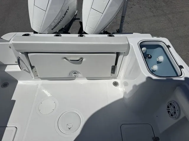 Slide: The Image of Wellcraft Fisherman 243 XB 2026 boat rear with engines and storage. - 16