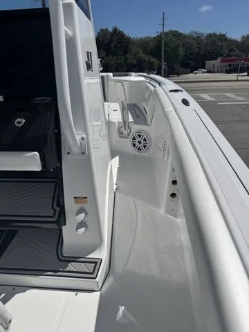 Slide: The Image of 2026 Wellcraft Fisherman 243 XB boat, side view, white deck. - 22