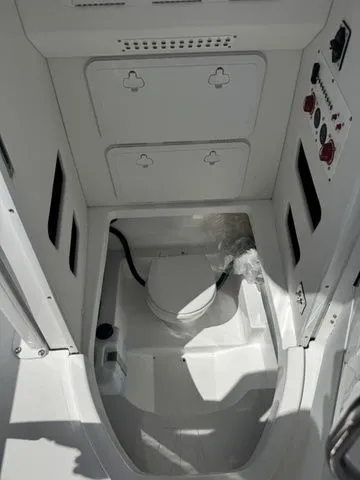 Slide: The Image of Interior of 2026 Wellcraft Fisherman 243 XB with toilet and storage. - 32