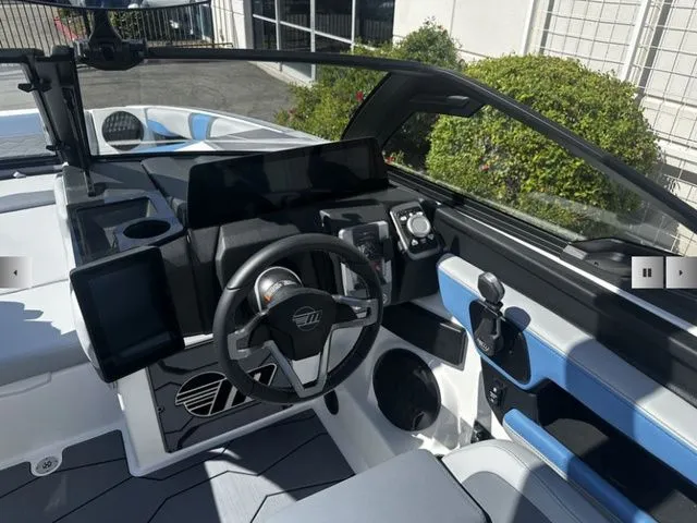 Slide: The Image of Interior of 2025 Malibu Wakesetter 23 MXZ with modern dashboard. - 13