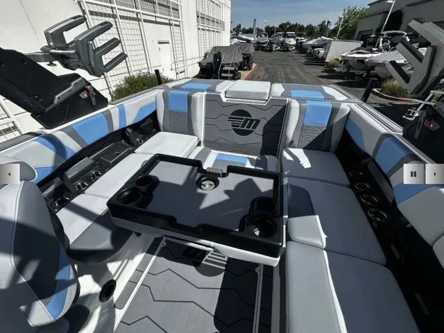Slide: The Image of Interior of 2025 Malibu Wakesetter 23 MXZ with modern seating. - 17