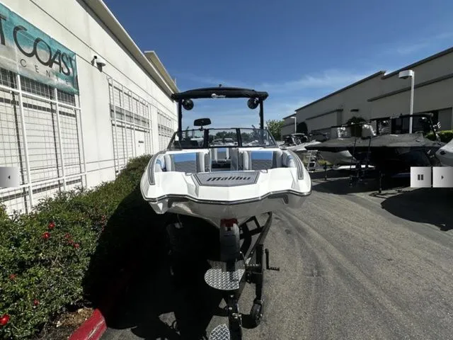 Slide: The Image of 2025 Malibu Wakesetter 23 MXZ boat on trailer outdoors. - 6