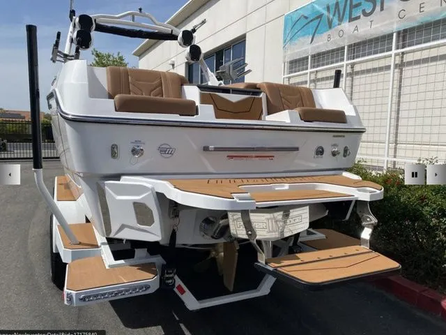 Slide: The Image of 2025 Malibu Wakesetter 25 LSV boat parked at dock. - 8