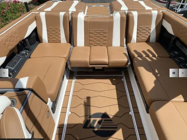 Slide: The Image of Interior of 2025 Malibu Wakesetter 24 MXZ with luxurious leather seating. - 11