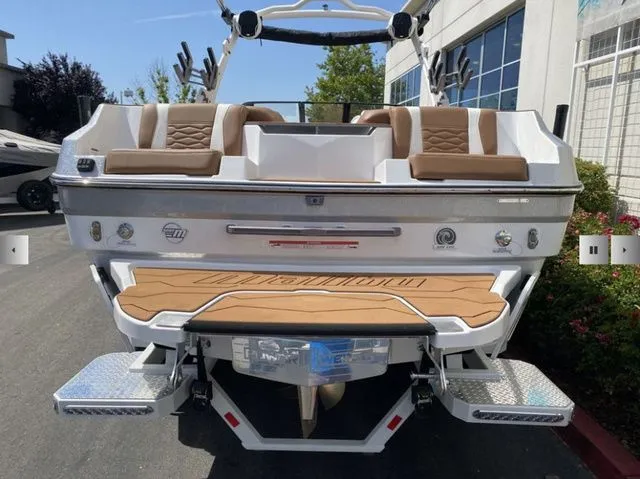 Slide: The Image of Rear view of 2025 Malibu Wakesetter 24 MXZ with luxurious seating. - 7