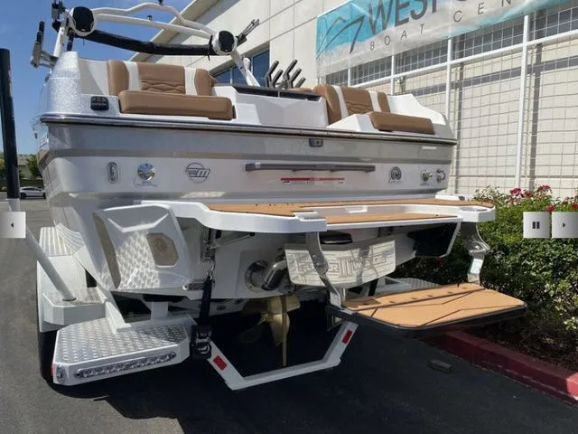 Slide: The Image of 2025 Malibu Wakesetter 24 MXZ boat parked at dock. - 8