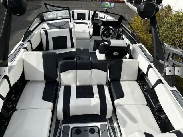 Slide: The Image of Interior of 2025 Malibu Wakesetter 23 MXZ with luxurious seating. - 12