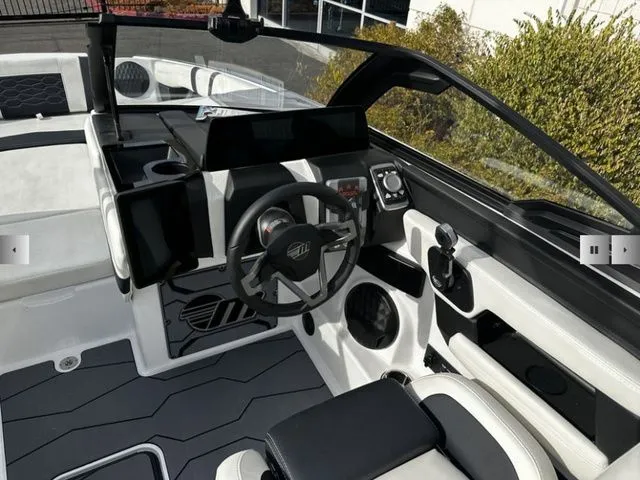 Slide: The Image of Interior of 2025 Malibu Wakesetter 23 MXZ with modern dashboard. - 7