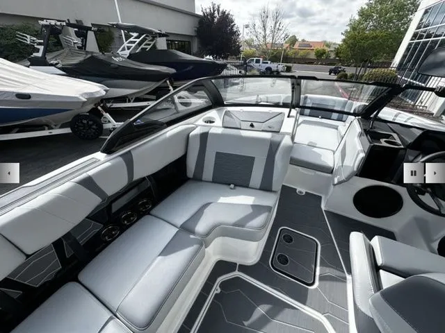 Slide: The Image of Interior of 2025 Malibu Wakesetter 22 MXZ with gray upholstery. - 10