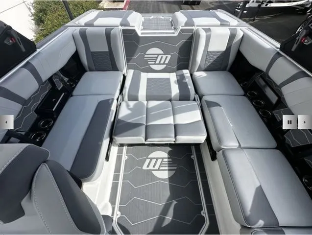 Slide: The Image of Interior of 2025 Malibu Wakesetter 22 MXZ with gray upholstery. - 11