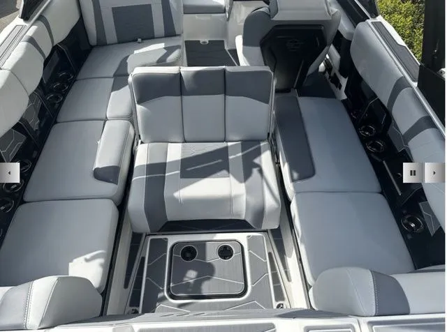 Slide: The Image of Interior of 2025 Malibu Wakesetter 22 MXZ with gray upholstery. - 12