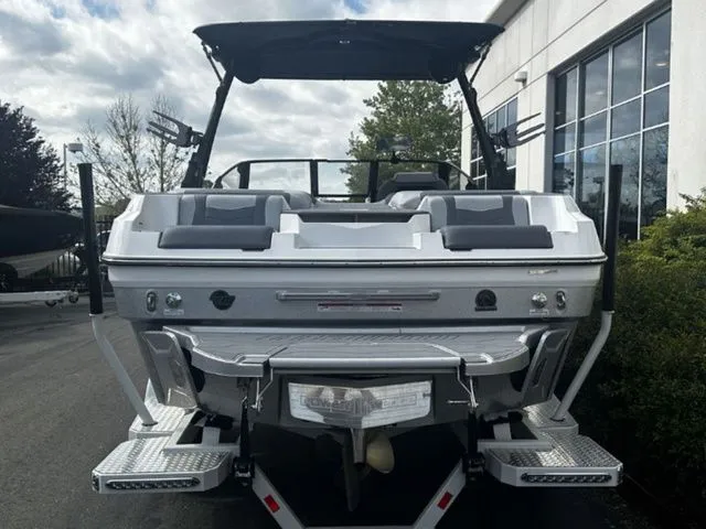 Slide: The Image of Rear view of 2025 Malibu Wakesetter 22 MXZ boat outdoors. - 4