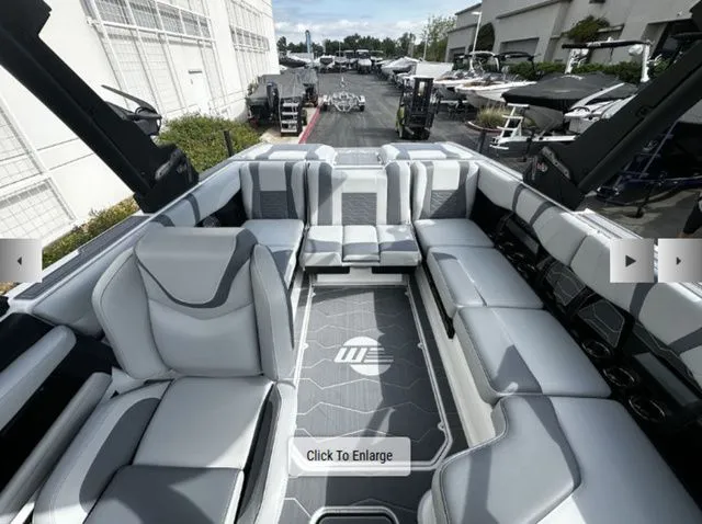 Slide: The Image of Interior of 2025 Malibu Wakesetter 22 MXZ with luxurious seating. - 7