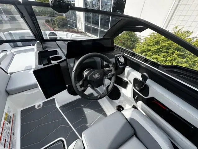 Slide: The Image of Interior of 2025 Malibu Wakesetter 22 MXZ with modern dashboard. - 8