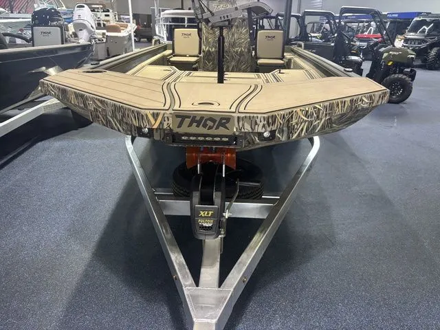 Slide: The Image of 2026 Thor Boats 1900 Lake Hammer on trailer in showroom. - 20