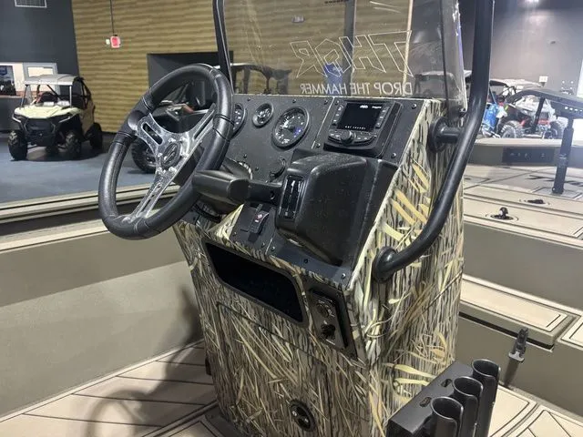 Slide: The Image of Thor Boats 1900 Lake Hammer 2026, center console with camouflage design. - 6