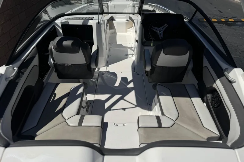 Slide: The Image of 2019 Yamaha Boats 212 Limited S interior with seating and steering wheel. - 10