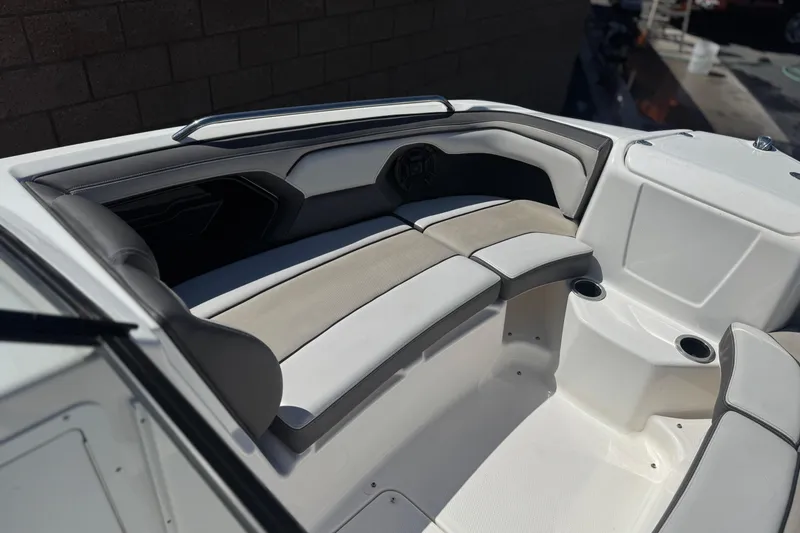 Slide: The Image of 2019 Yamaha Boats 212 Limited S interior seating with cup holders, featuring sleek design. - 15