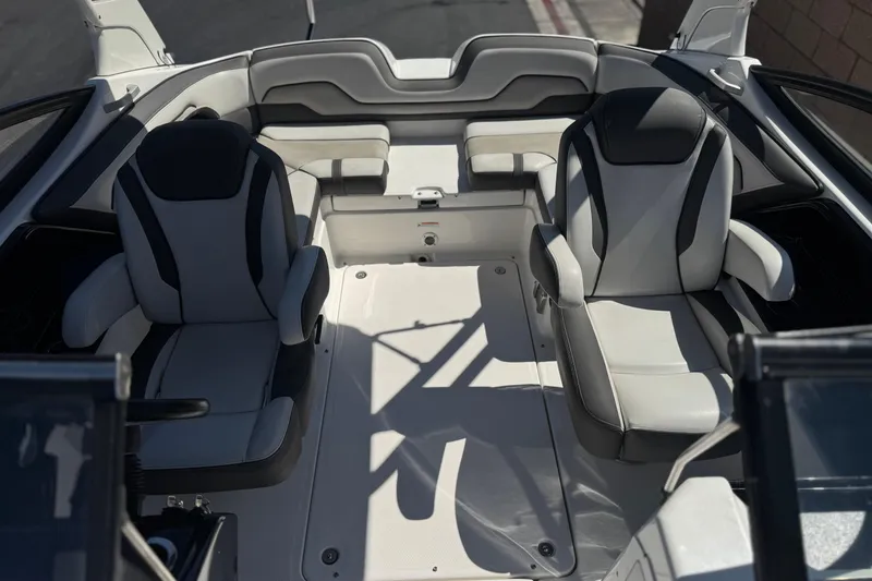 Slide: The Image of Interior of a 2019 Yamaha Boats 212 Limited S, featuring sleek seating and modern design. - 18