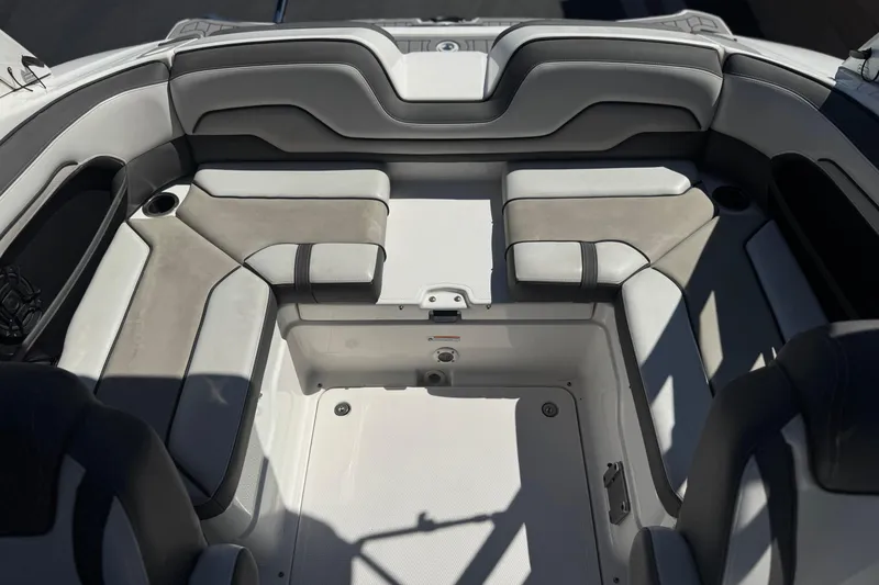 Slide: The Image of 2019 Yamaha Boats 212 Limited S interior seating area with gray upholstery. - 19