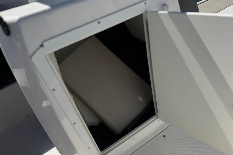 Slide: The Image of Open storage compartment on a 2019 Yamaha Boats 212 Limited S. - 25