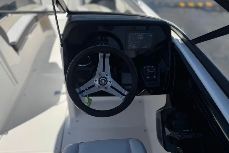 Slide: The Image of Steering wheel and dashboard of 2019 Yamaha Boats 212 Limited S. - 28