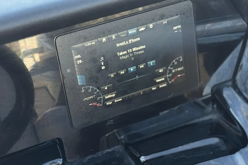 Slide: The Image of Dashboard display of a 2019 Yamaha Boats 212 Limited S showing music controls. - 29