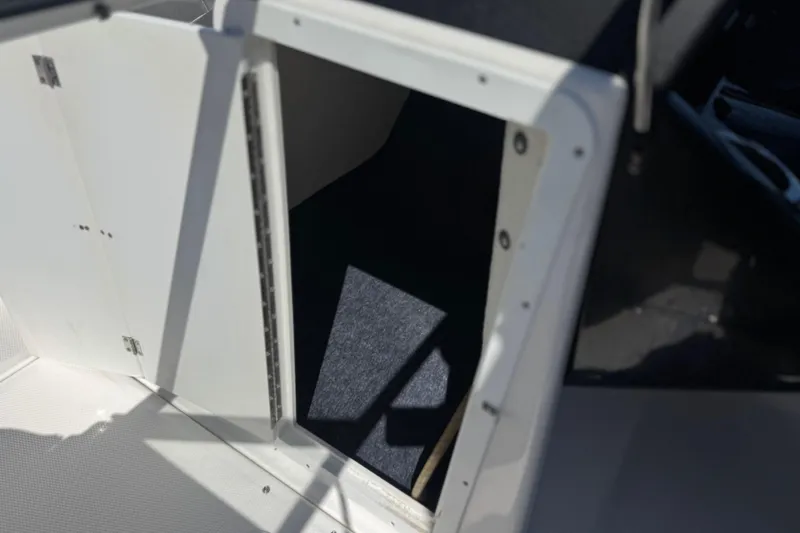 Slide: The Image of Open storage compartment on a 2019 Yamaha Boats 212 Limited S. - 36