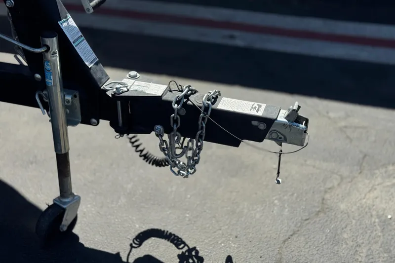 Slide: The Image of Trailer hitch of a 2019 Yamaha Boats 212 Limited S on pavement. - 38