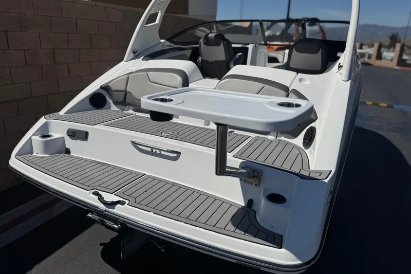 Slide: The Image of 2019 Yamaha Boats 212 Limited S with swim platform and seating area. - 6