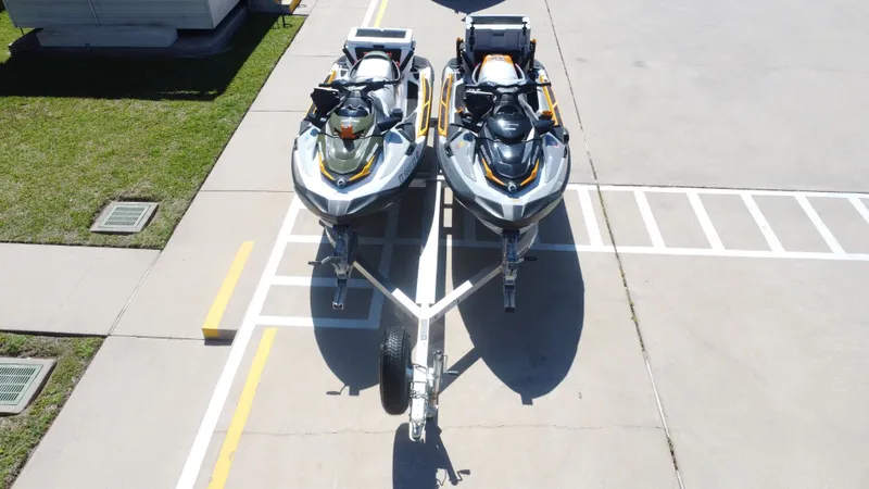 Slide: The Image of Two Sea-Doo 14' FISH PRO 2019 jet skis on trailer. - 14