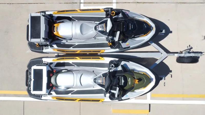 Slide: The Image of Two 2019 Sea-Doo 14' FISH PRO jet skis on trailer, aerial view. - 24