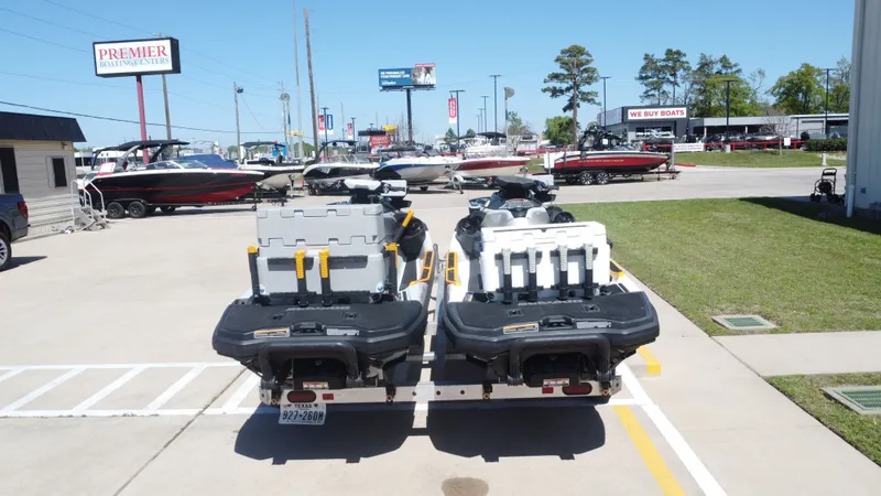 Slide: The Image of 2023 Sea-Doo 14' FISH PRO TROPHY jet skis parked in a lot. - 5