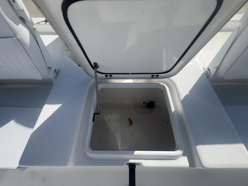 Slide: The Image of Open storage compartment on a 2013 Sea Fox 180XT boat. - 22