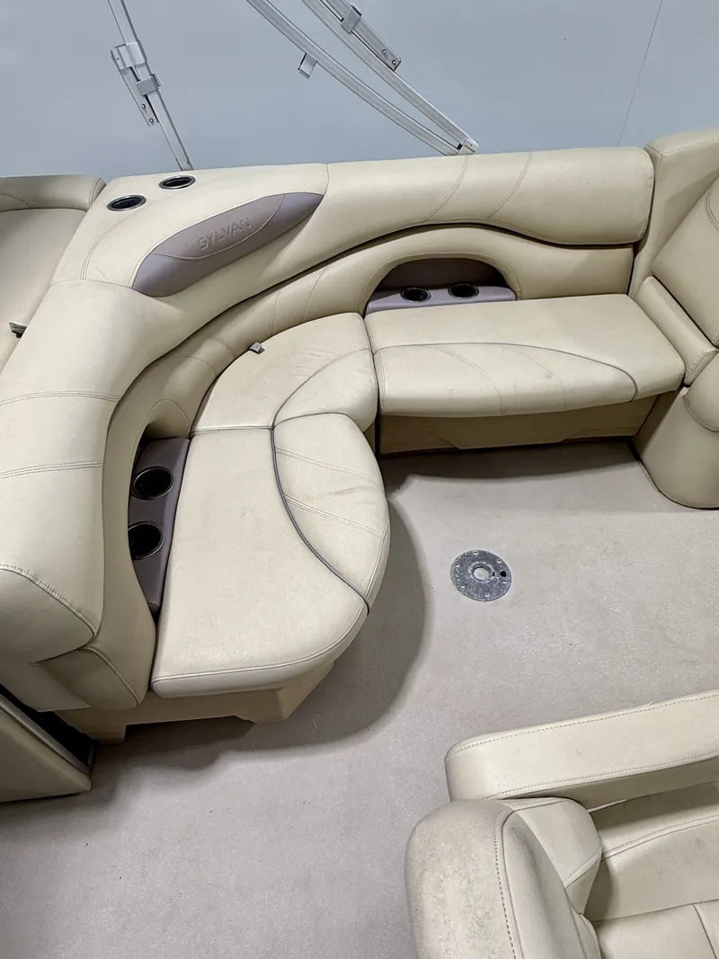 Slide: The Image of Interior of a 2017 Sylvan 8520 boat with beige leather seating. - 13