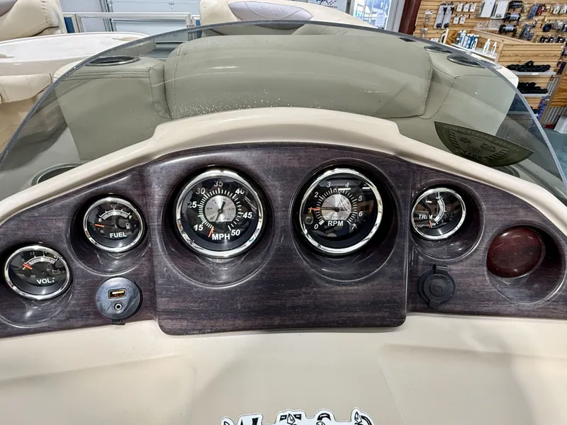 Slide: The Image of Dashboard of a 2017 Sylvan 8520 boat with gauges. - 15