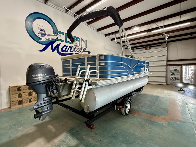 Slide: The Image of 2017 Sylvan 8520 pontoon boat in warehouse with Yamaha motor. - 9