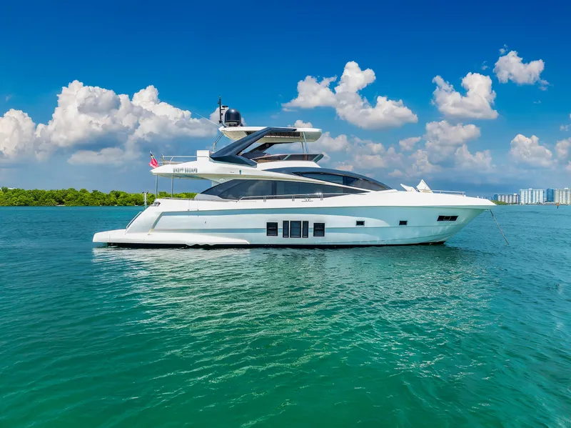 The Image of Luxurious 2013 Astondoa 72 GLX yacht cruising on clear blue waters. - 0
