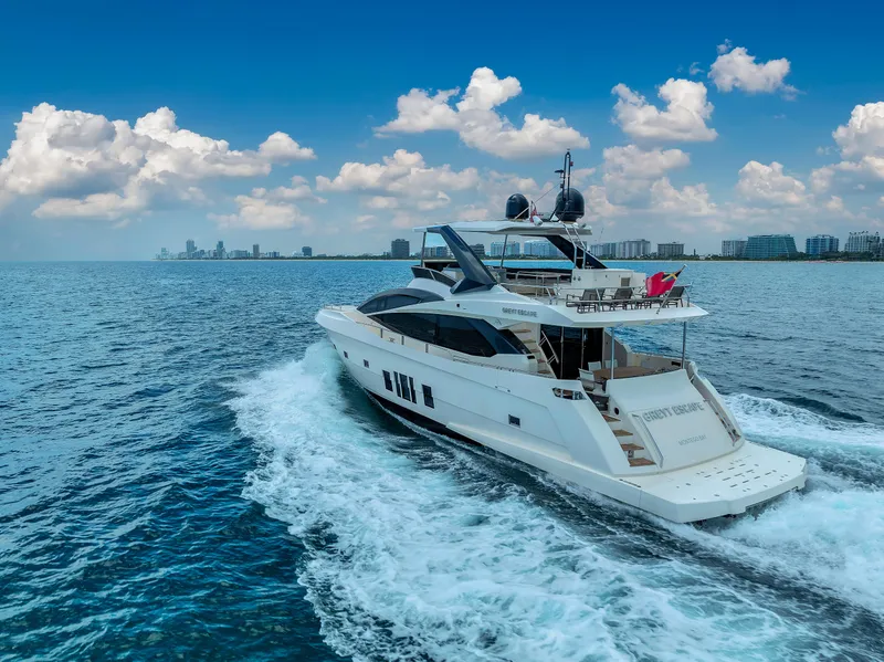 Slide: The Image of Astondoa 72 GLX yacht cruising on open water, 2013 model, under a clear blue sky. - 14