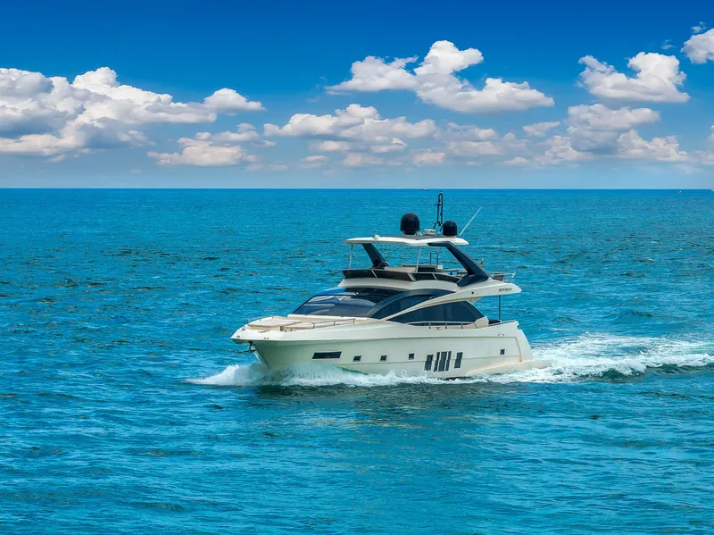 Slide: The Image of Astondoa 72 GLX yacht cruising on open sea, 2013 model, under clear blue sky. - 23
