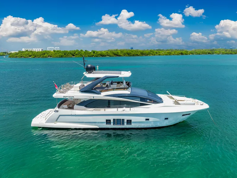 Slide: The Image of 2013 Astondoa 72 GLX yacht cruising on clear blue waters. - 24
