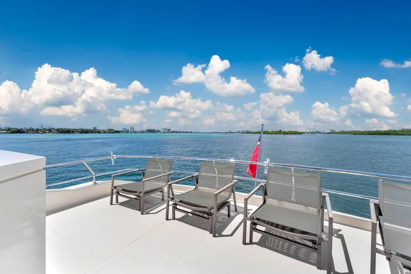 Slide: The Image of Astondoa 72 GLX yacht deck with chairs, ocean view, and blue sky. - 26