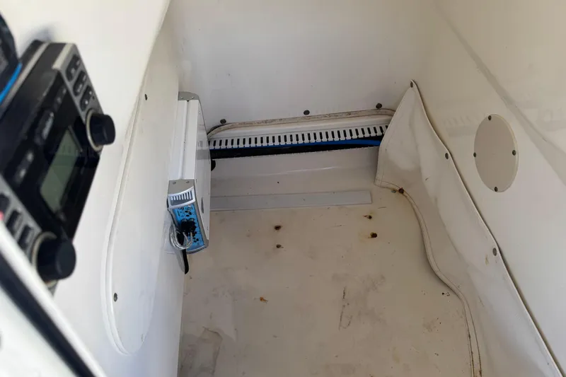 Slide: The Image of Interior of a 2012 Boston Whaler 200 Dauntless boat, featuring electronic equipment. - 18