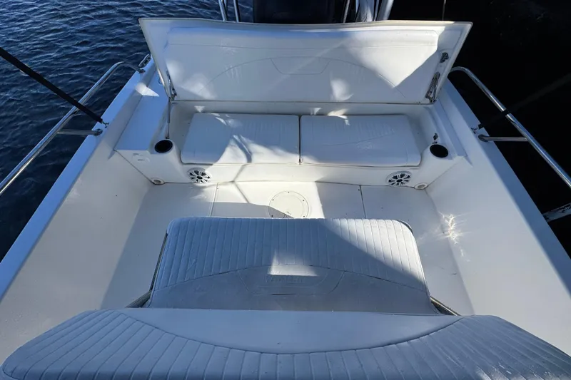Slide: The Image of Interior of a 2012 Boston Whaler 200 Dauntless boat with seating area. - 5