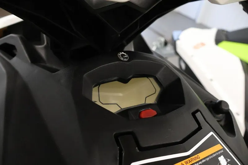 Slide: The Image of 2023 Sea-Doo Spark 3up dashboard close-up with digital display and controls. - 10