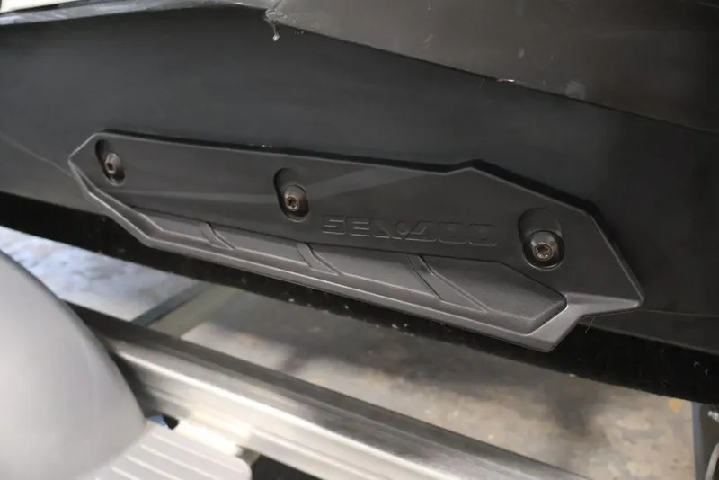 Slide: The Image of 2023 Sea-Doo Spark 3up hull detail with Sea-Doo branding and mounting screws. - 14