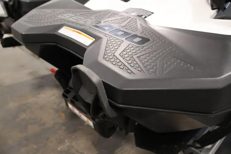 Slide: The Image of 2023 Sea-Doo Spark 3up jet ski rear view, showcasing textured design. - 21
