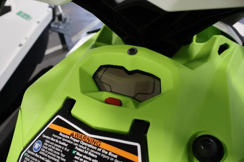Slide: The Image of 2023 Sea-Doo Spark 3up dashboard with warning label and vibrant green design. - 22